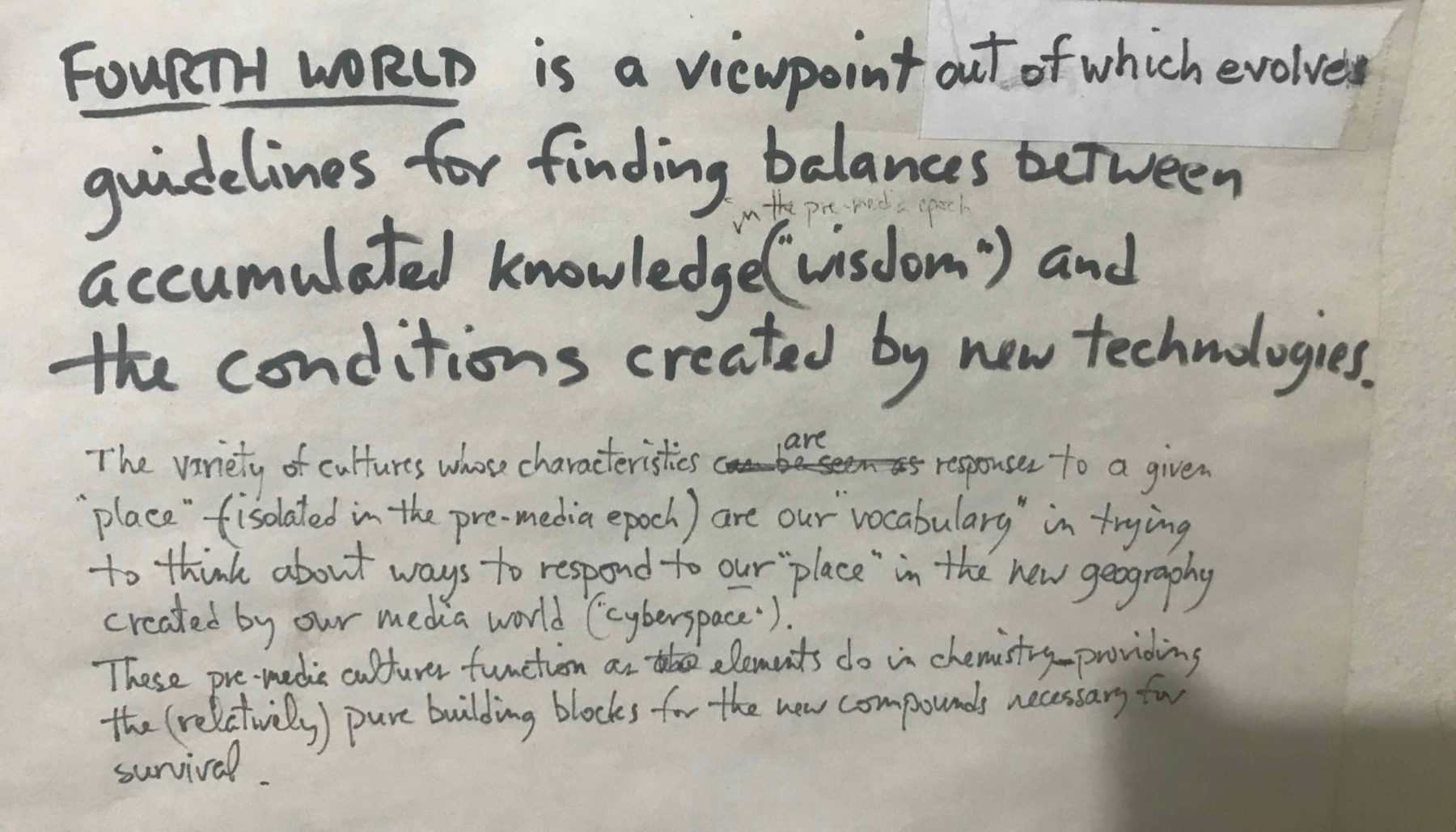 A sheet of paper handwritten in black marker, headed FOURTH WORLD, defining it as a viewpoint out of which evolve guidelines for finding balances between accumulated knowledge and the conditions created by new technologies
